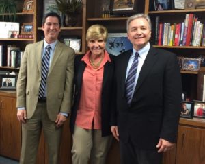 Buddy Tobin (left) and Jeff Heikke (right) meet with Fort Worth Mayor Betsy Price after signing the agreement on their new facility. 